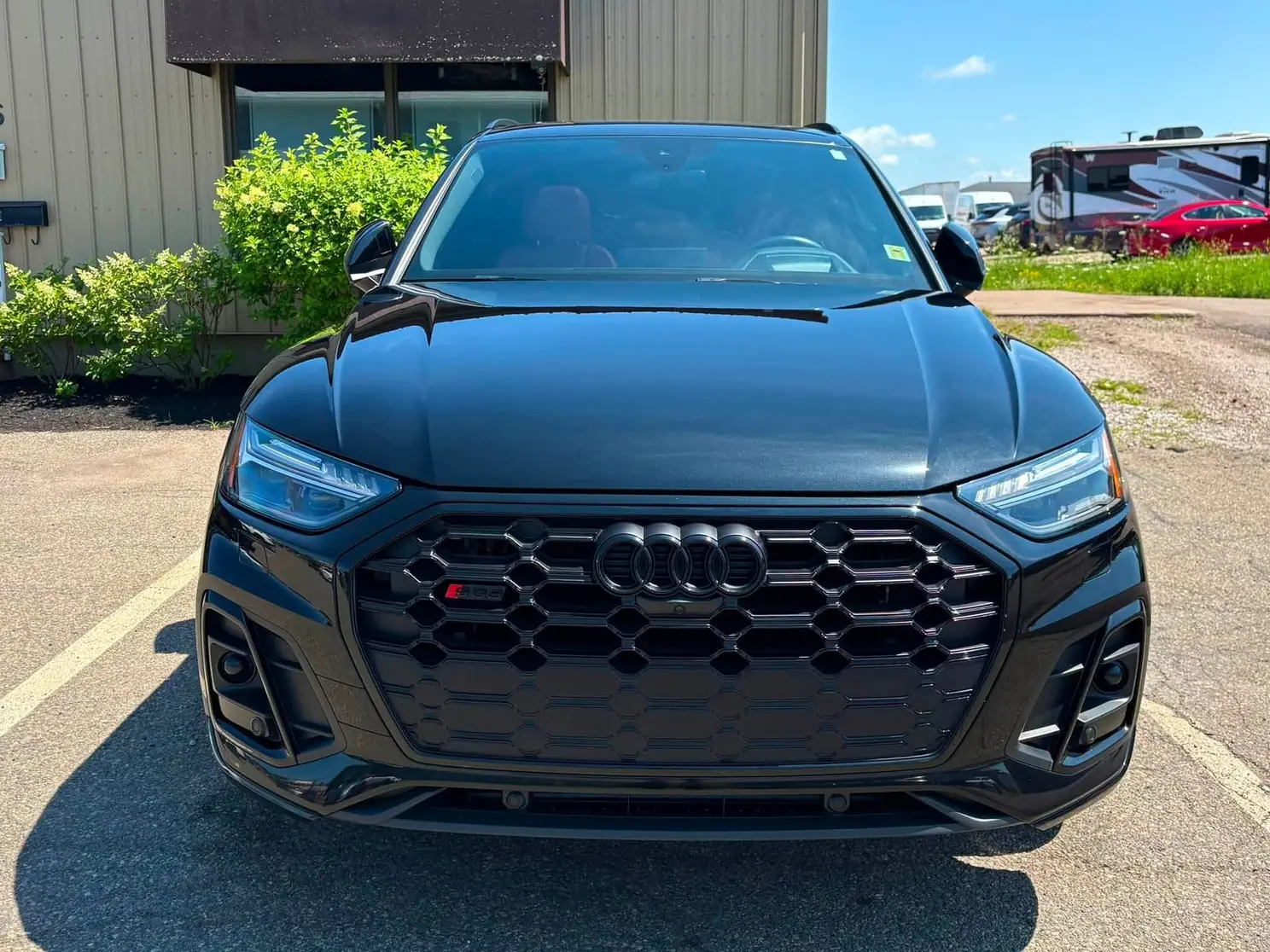 Black Audi SUV after a detail, front view