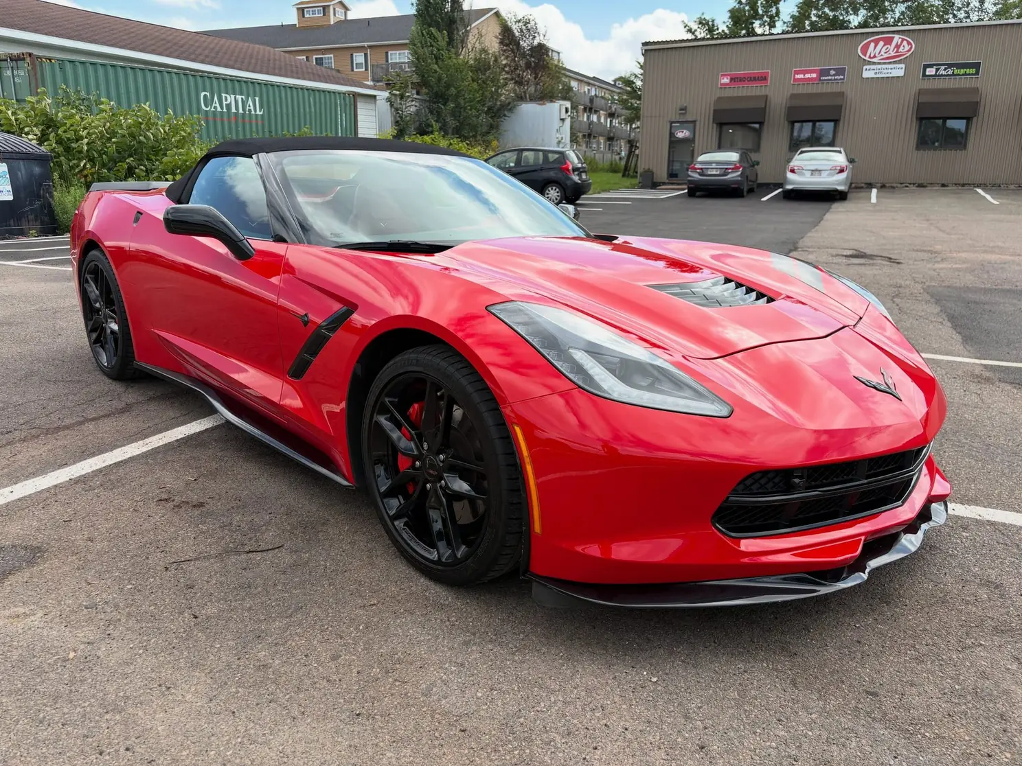 Red Corvette after a complete detail and sealant protection, side view