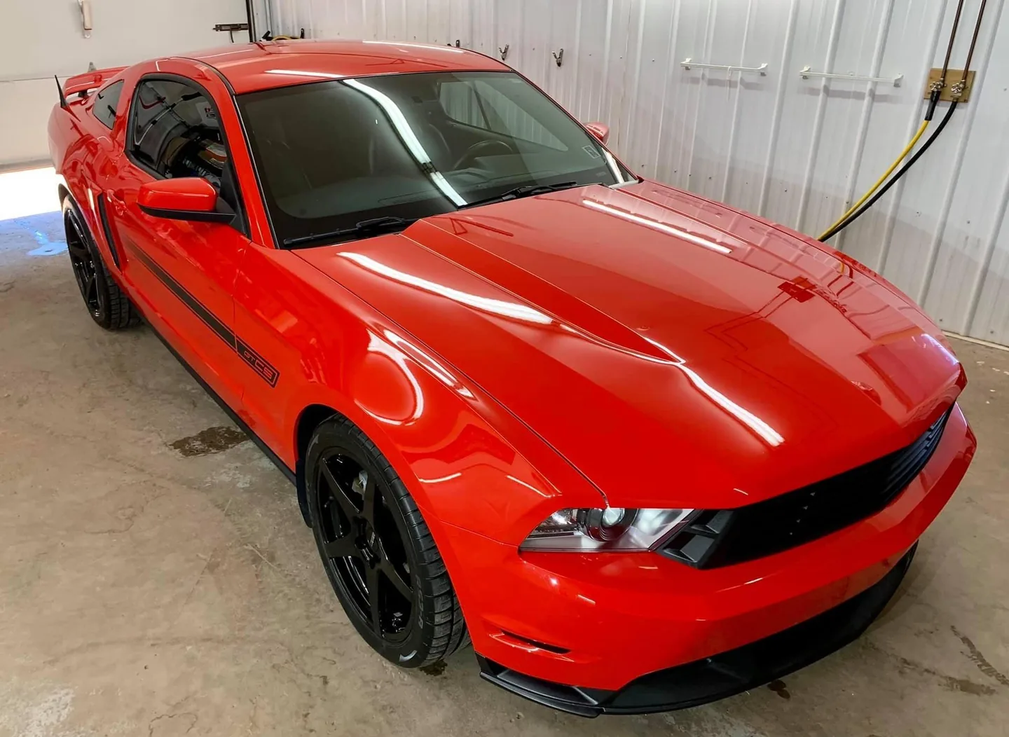 Red Ford Mustang GT inside the CarShine shop